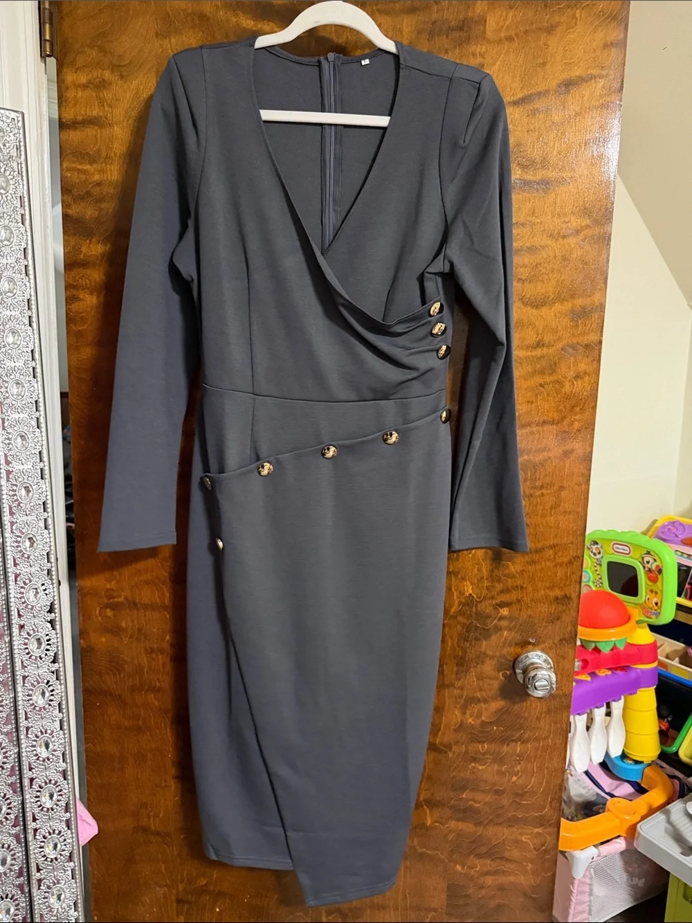 Classic Long-Sleeve Black Sheath Dress with Gold Button Detail